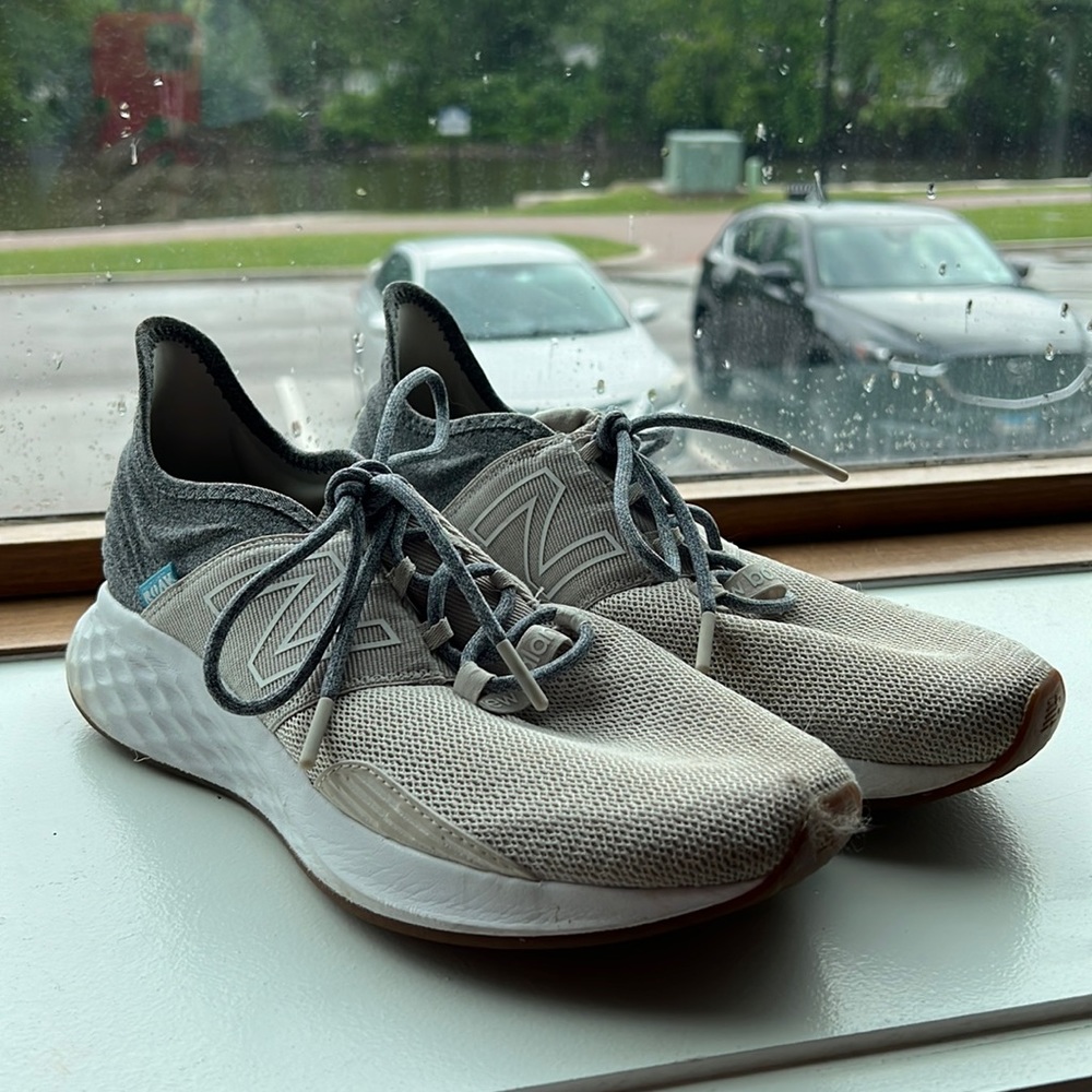New Balance cream and gray running shoes.
